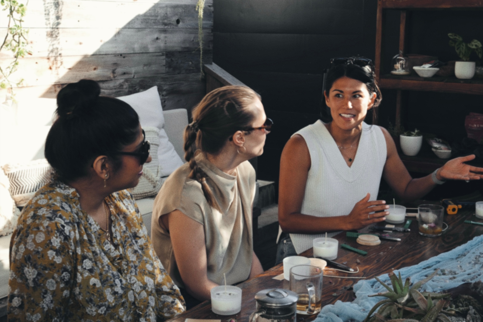 Three women in conversation at a gathering
